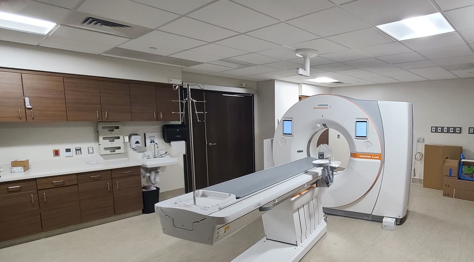 The finished CT suite at Novant Health Ballantyne Medical Center, with the Siemens SOMATOM scanner, patient table and built-in casework.